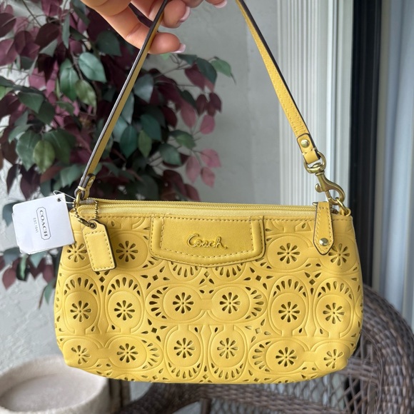 Coach Handbags - NWT Coach Yellow Floral Cutout Wristlet